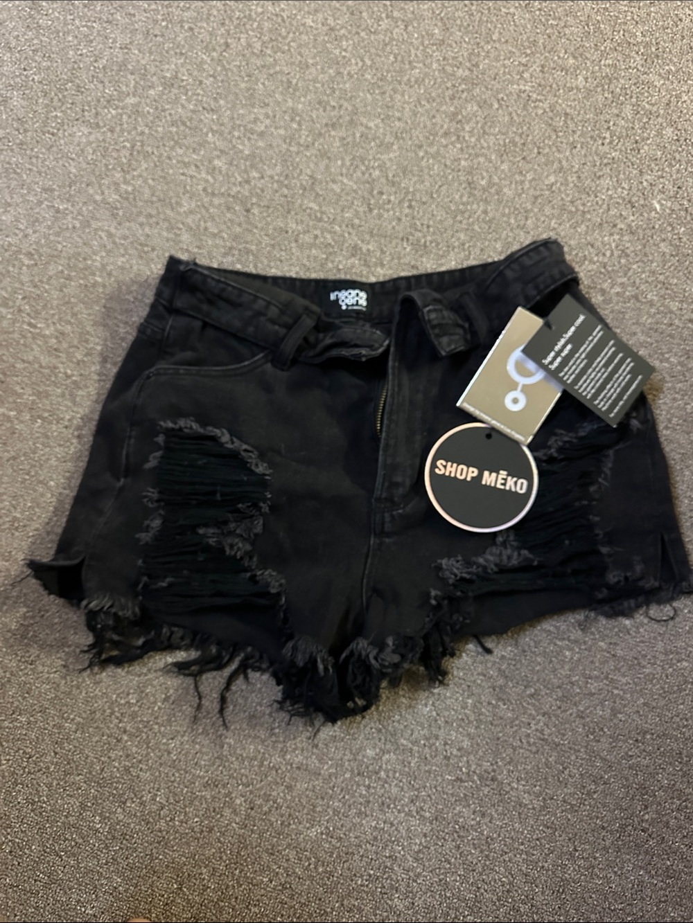 High end Black Distressed High-Waist Denim Shorts tags on